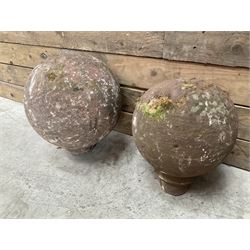 Two spherical stone gate post finials