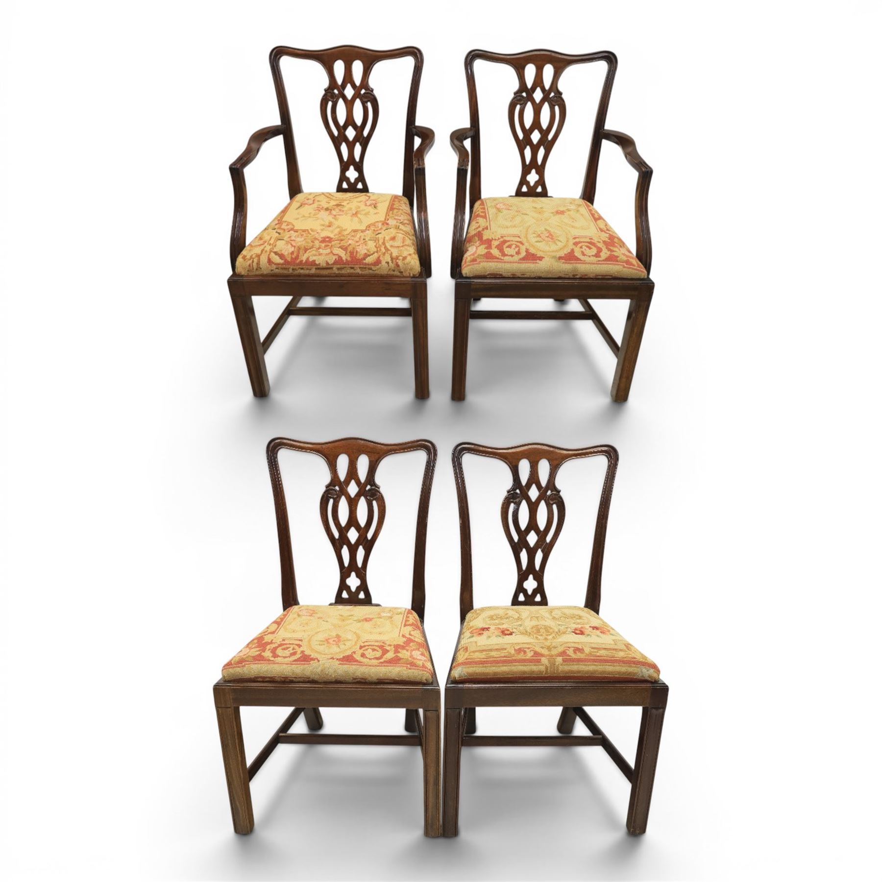 Large 19th century mahogany extending dining table with set of Chippendale design chairs, extending dining table with rectangular moulded top additional three leaves, raised on turned supports terminating in brass castors, the dining chairs (2 + 2) with shaped cresting rail and pierced splats, raised on square supports with stretchers