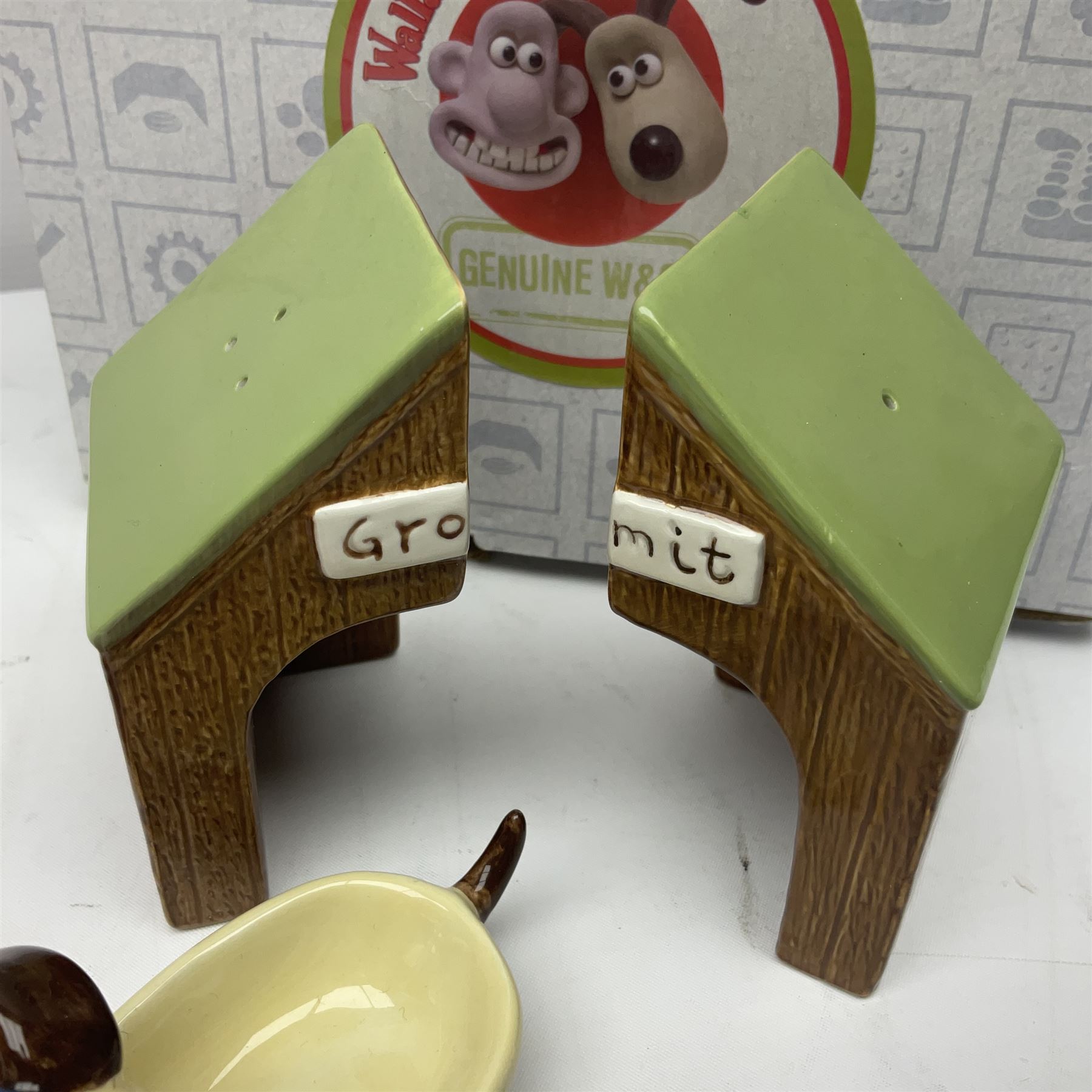 Border Fine Arts Shaun The Sheep Tractor Train and musical figure, together with a Wallace and Gromit photograph frame and a Gromit cruet sett, three in original boxes  
