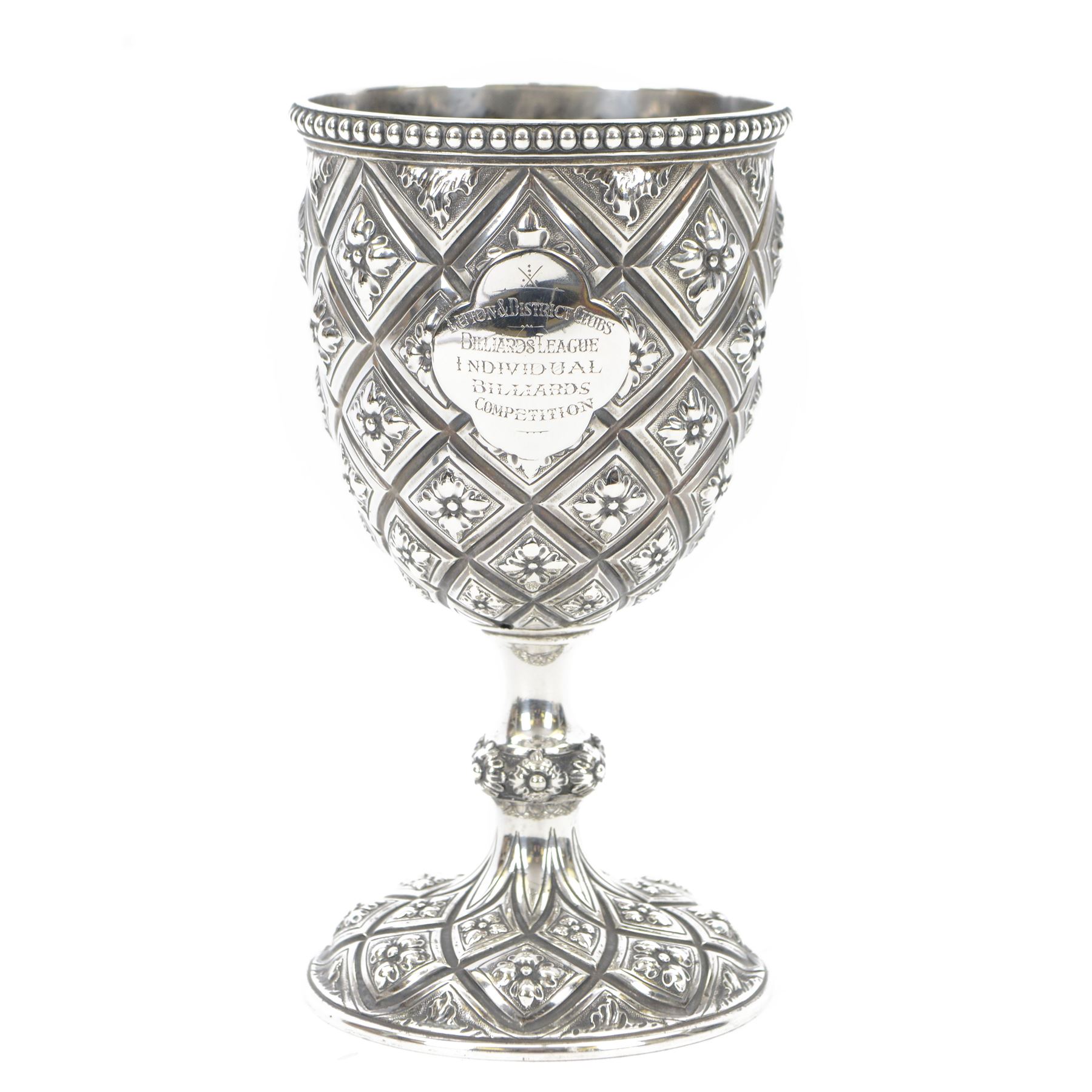 Victorian silver trophy cup or goblet, the cup with personally engraved quatrefoil panel and beaded rim, upon a knopped flower head detailed stem and spreading circular foot, embossed throughout with a flower head diamond trellis pattern, hallmarked Robert Hennell III, London 1860, H18cm