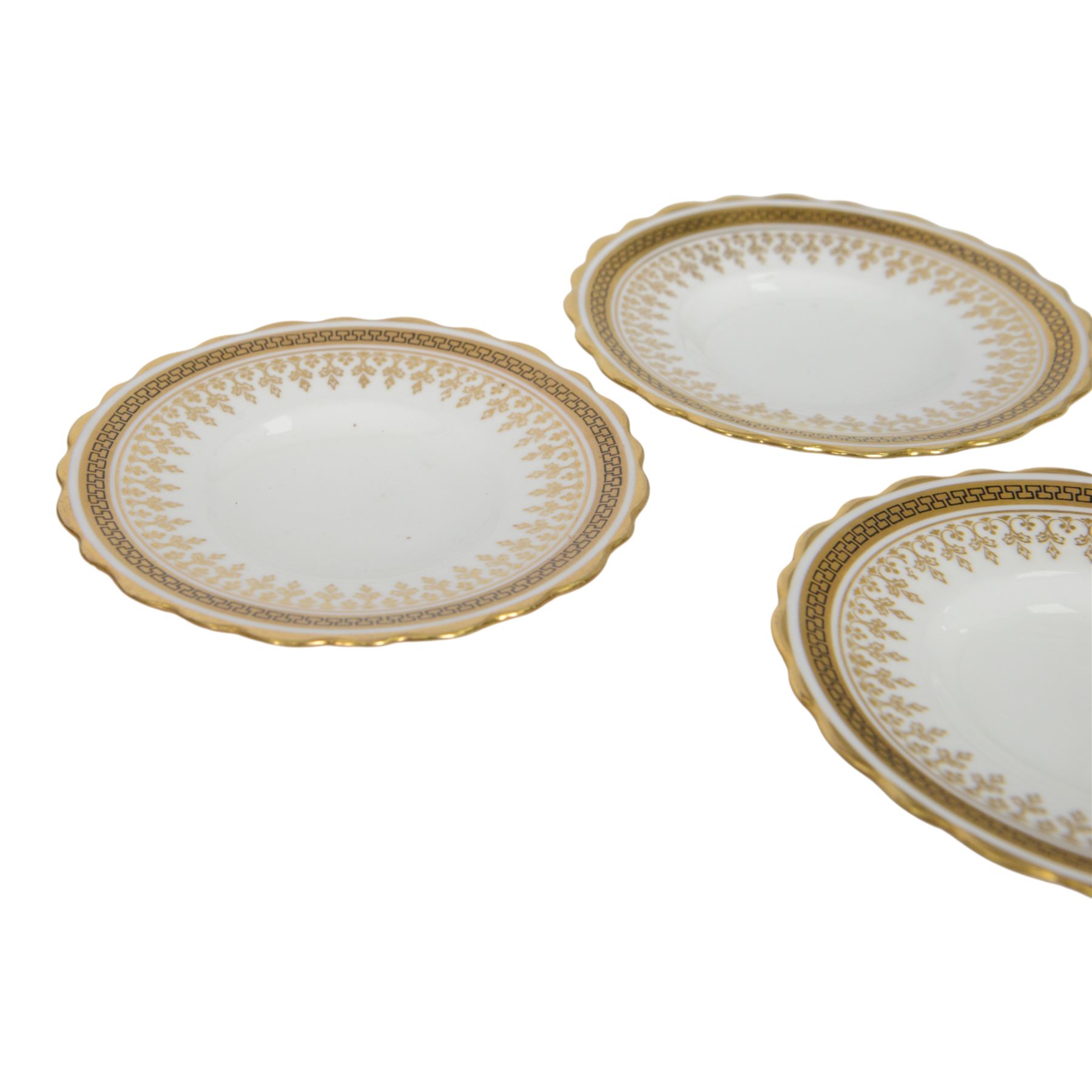 Boxed set of six Aynsley coffee cans and saucers, decorated with gilt greek key border, the cans within silver mounts, hallmarked Birmingham 1911