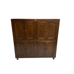 Large oak cupboard, fitted with eight panelled doors