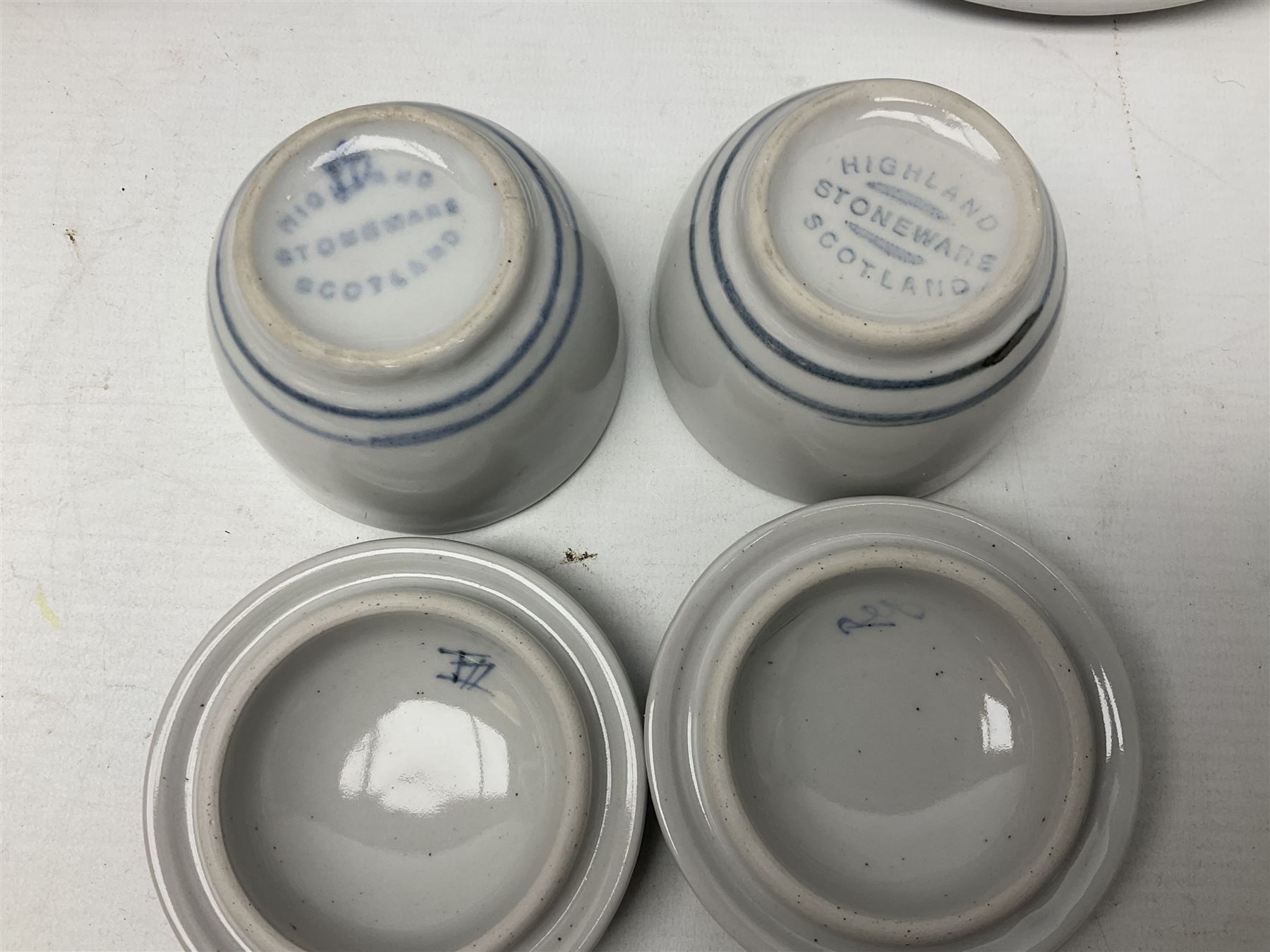 Highland Stoneware Scotland, decorated with landscapes and seascapes, comprising of two bowls, plate and two covered trinket boxes 