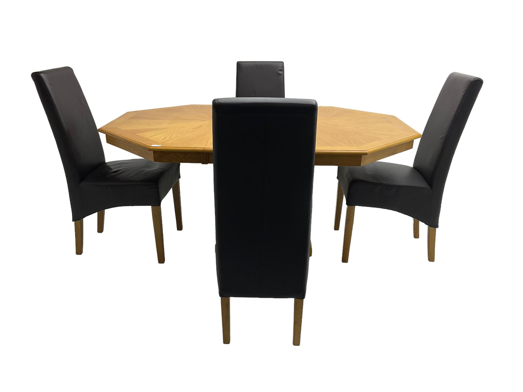 Oak octagonal extending dining table with additional leaf, octagonal pedestal base with fluting (150cm x 105cm x 76cm), and set four high back dining chairs upholstered in chocolate brown faux leather on square tapering supports (47cm x 54cm x 102cm)