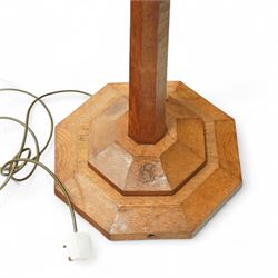 Squirrelman - oak standard lamp, the octagonal stepped base carved with the signature squirrel, the tapering octagonal column rising to a brass fitting, by Wilfrid Hutchinson, Husthwaite