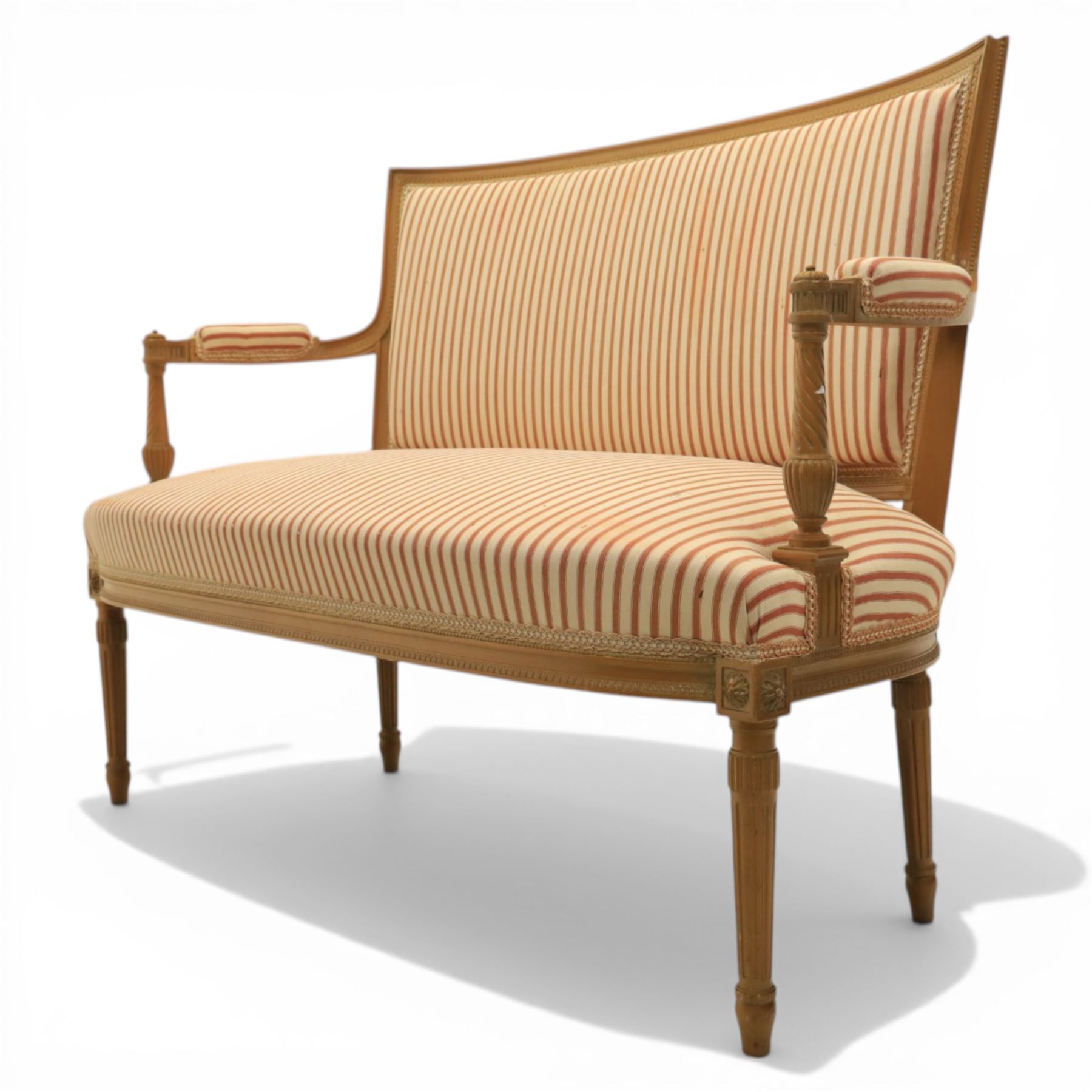 20th century Louis XVI style beech salon suite, comprising settee and four chairs, the settee with shaped rectangular back and upholstered arms over a shaped seat, the chairs with rectangular backs and overstuffed seats, each upholstered in striped fabric with close-nailed borders, upon fluted tapering supports headed by carved paterae, terminating in toupie feet, chairs H89cm W47cm