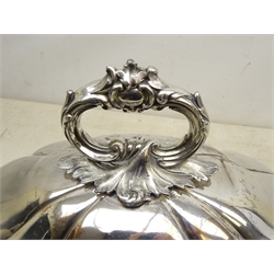  Early Victorian Old Sheffield plate meat dome, oval, partly fluted form, engraved with family crest, surmounted by a detachable scrolling foliate handle, L46cm  