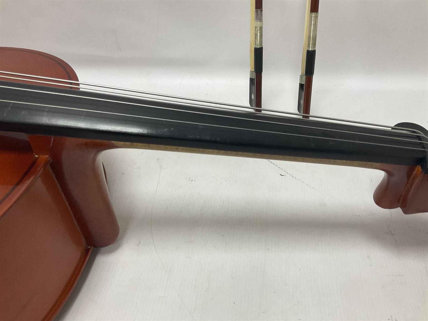 Gear 4 Music full size cello with a maple back and ribs and spruce top, ebony fittings and fingerboard, with two bows in hard case Length 123cm