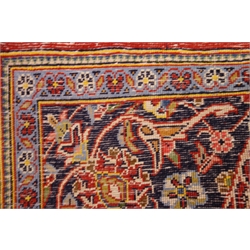  Persian red ground rug, blue border, central medallion, 182cm x 108cm  