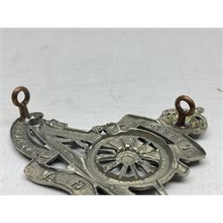 Third Middlesex Royal Garrison Artillery Volunteers Cap Badge, white meta Royal Artillery cap badge with “THIRD” to the top scroll and lower three part scroll “MIDDLESEX – R.G.A. – VOLUNTEERS”. Three lug fittings to the reverse.