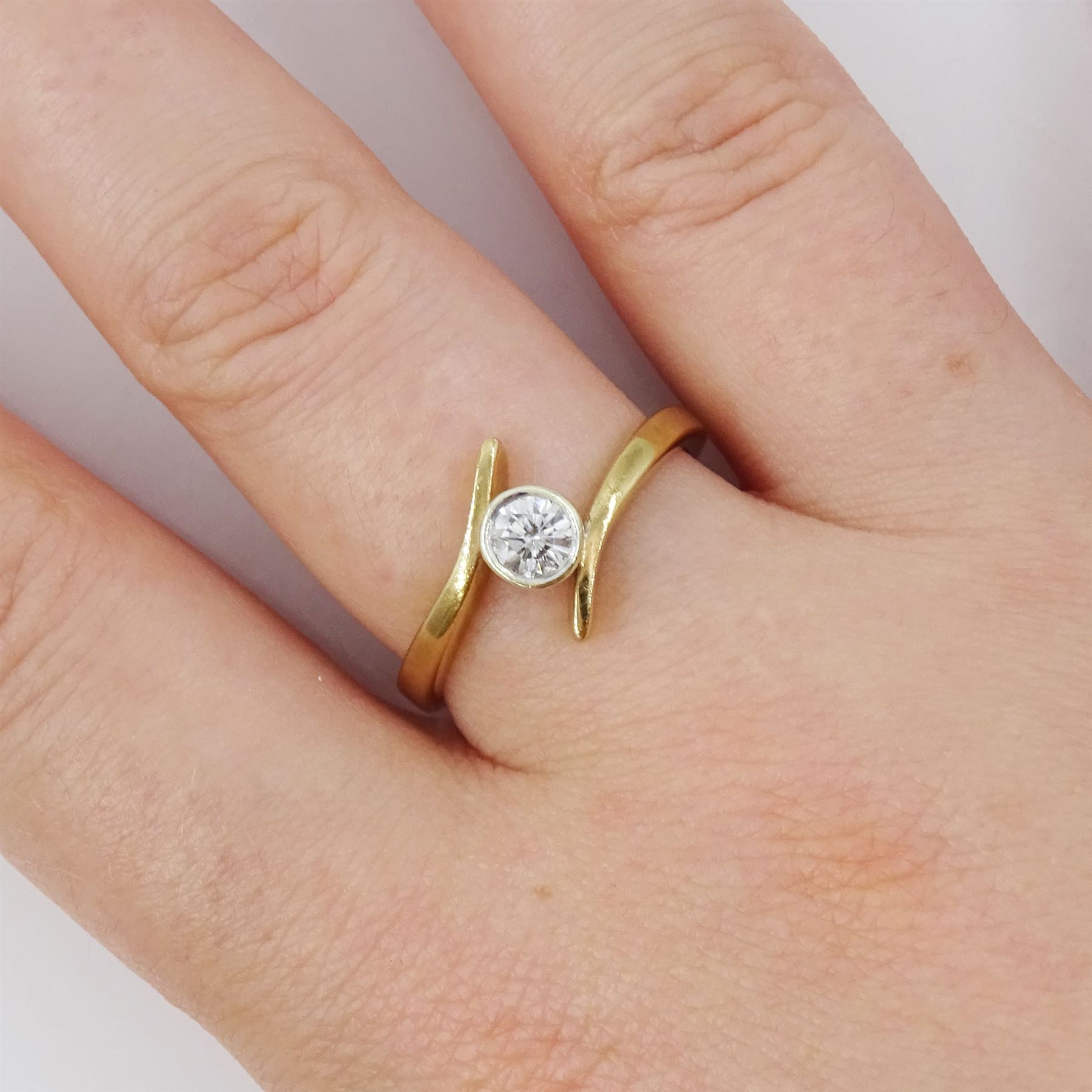 9ct gold diamond ring, single round brilliant cut diamond of approx 0.25 carat, in a crossover setting, hallmarked