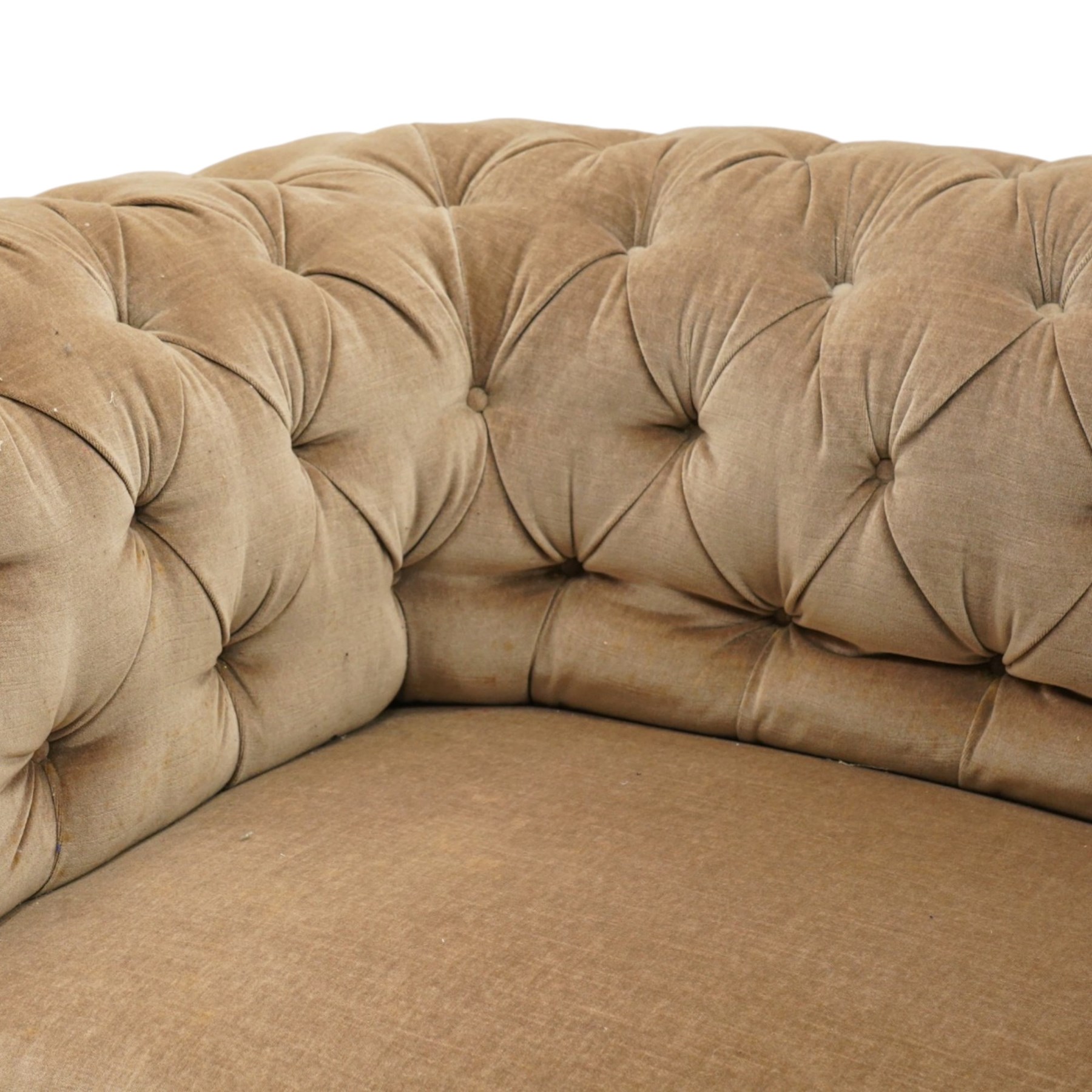 Victorian mahogany framed two seater Chesterfield settee, traditional shape with rolled back and arms over sprung seat, upholstered in buttoned-back neutral fabric, raised on turned front supports with ceramic castors