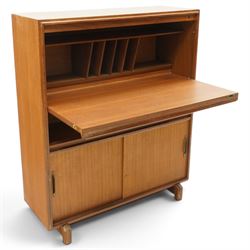 Robert Heritage (1927-2008) for Beaver & Tapley - Mid 20th century teak bureau, fall front with fitted interior, above a sliding door cabinet, raised on short supports