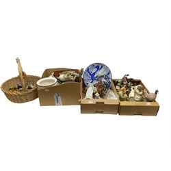 Cast iron pheasant doorstop, two Capodimonte tramp figures, quantity of ceramics to include Delft style , quantity of Warner Bros Carosello decanters etc in three boxes and basket