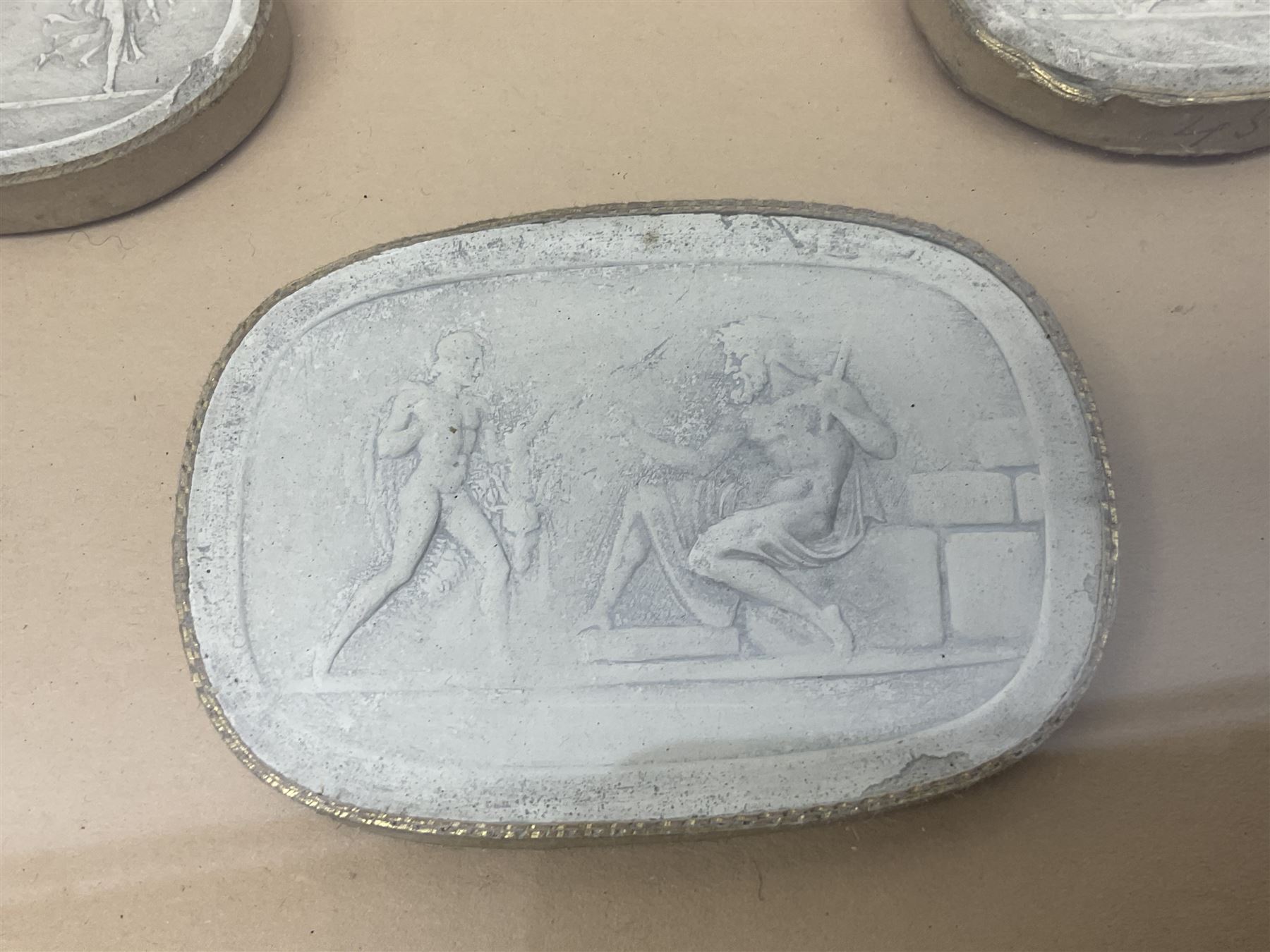 Set of six 19th century Grand Tour plaster intaglios, each depicting classical figures, frame H25cm, W19cm