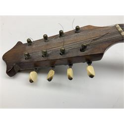 Italian mandolin, with foliate inlaid scratchplate, paper label inscribed 'Carlo Loveri & Figlio of Napoli', L62cm