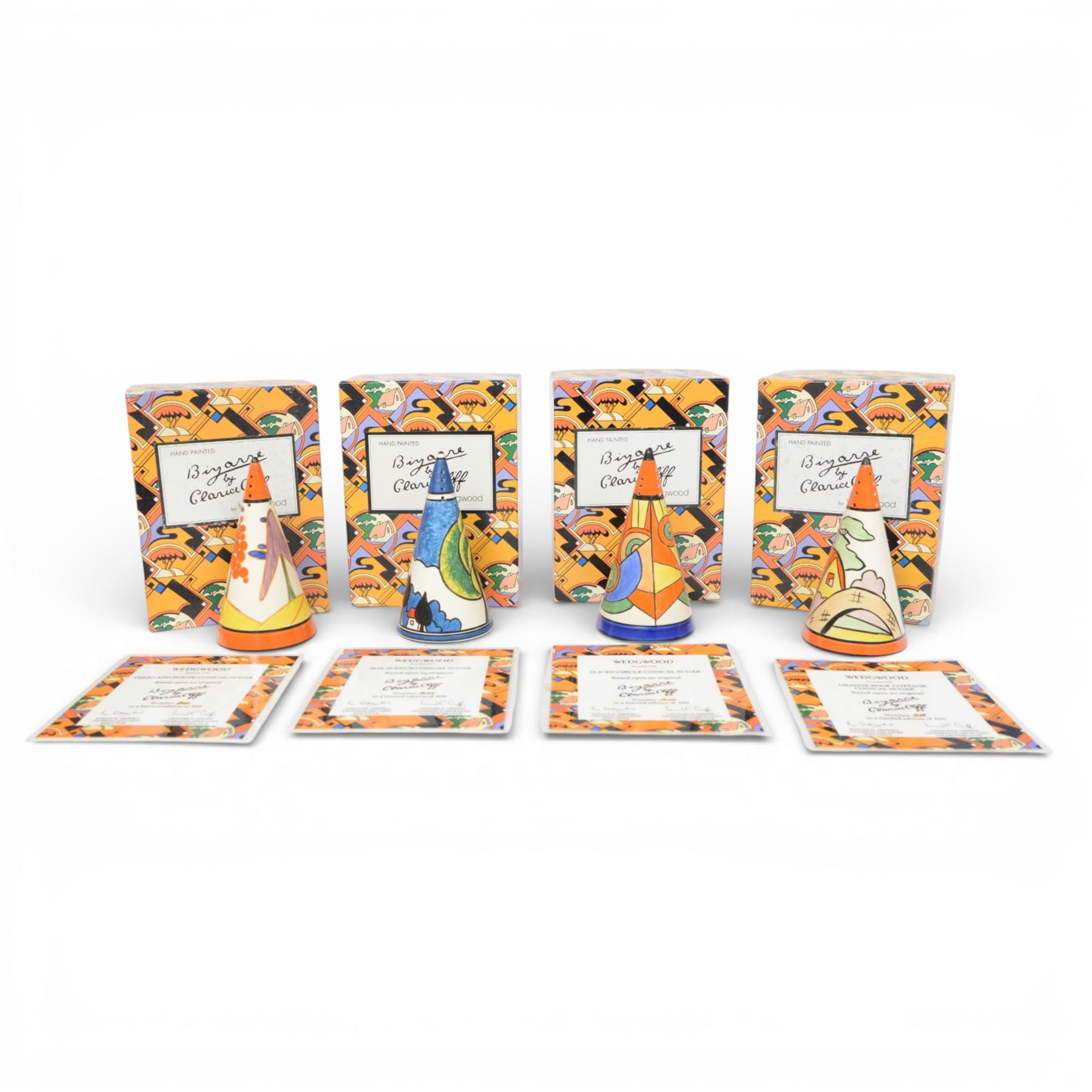 Wedgwood Bizarre by Clarice Cliff, four Conical Sugar shakers, comprising May Avenue, Trees and House, Sliced Circle and Orange Roof Cottage, all with certificates and boxes 