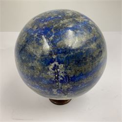 Lapis lazuli sphere upon a carved wooden base 