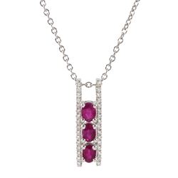 18ct white gold ruby and diamond pendant, three oval rubies, with round brilliant cut diamonds set each side, on 9ct white gold necklace chain, both hallmarked