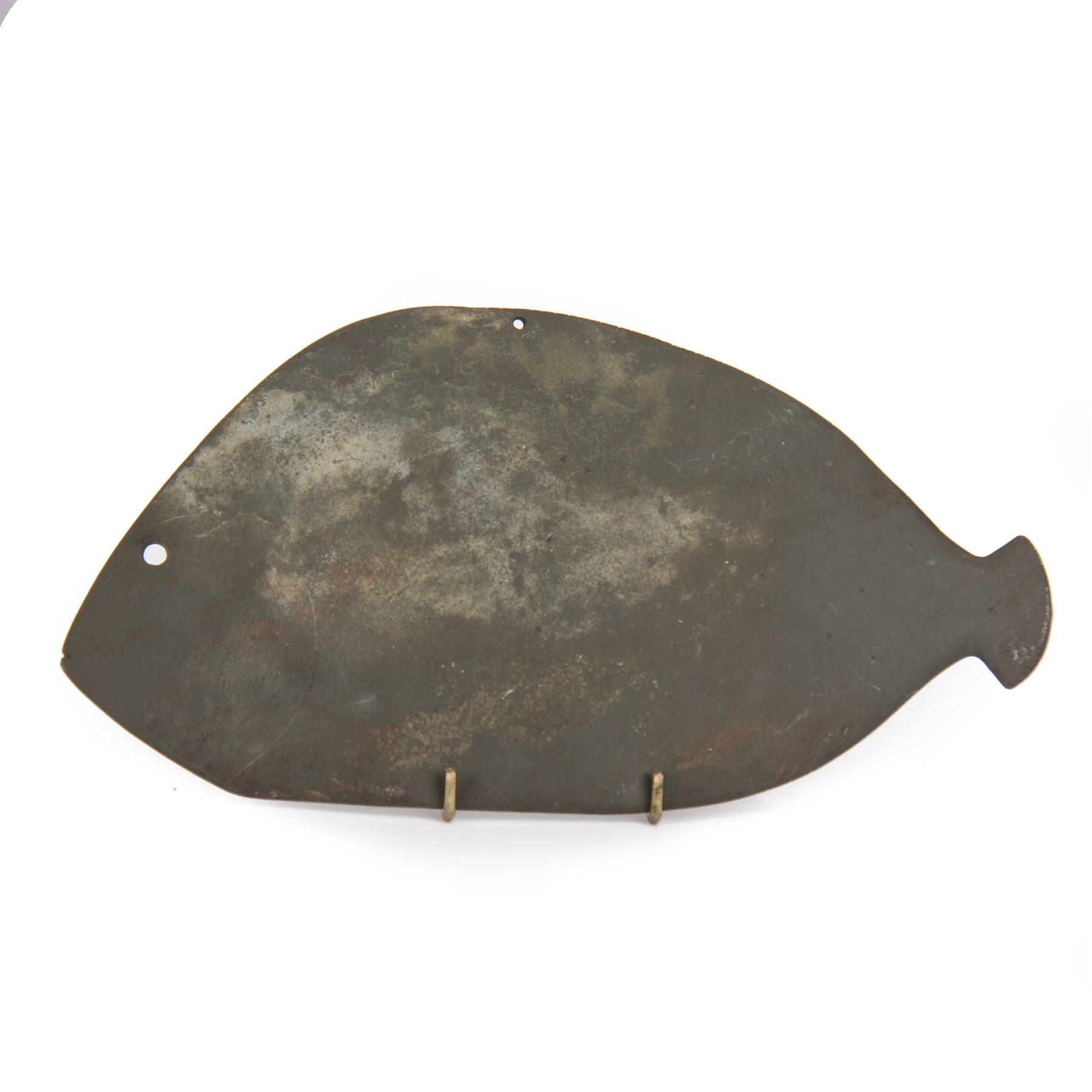 Egyptian greywacke or schist cosmetic palette, circa 3500-3200 B.C., carved in the form of a fish with drilled eye, small incised mouth, and small protruding tail, pierced at the top for suspension, L26cm

