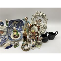 Two 19th century blue and white pickle dishes, each decorated in a variant of the Willow pattern, 19th century blue and white Willow pattern dessert dish, further Willow pattern dish, two black basalt jugs, small Victorian cockle dish, plus a group of Victorian and later figures, to include two Staffordshire arbour groups, one with beehive, Staffordshire style model of a sheep, two Sitzendorf monkey band figures, a Continental figure group modelled as a dancing couple, Atlas China figure of a Satyr, two jugs modelled as Punch and Judy, Rd no 139844, etc. 