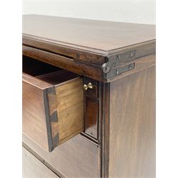 George III mahogany bachelors chest, the moulded rectangular fold over top with leather inset supported by two slide out stays, fitted with two short and three long graduating drawers, on bracket feet