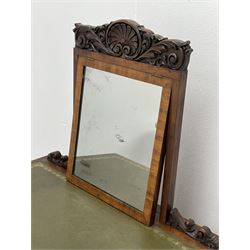 Early Victorian figured mahogany dressing cabinet, the raised shell and scroll carved back lifts to reveal rectangular easel mirror with mahogany band, flat rectangular top with tooled leather inset, slide at each side with matching leather inset, full width drawer above cupboard enclosing a series of five drawers, turned front supports, panelled front, sides and back