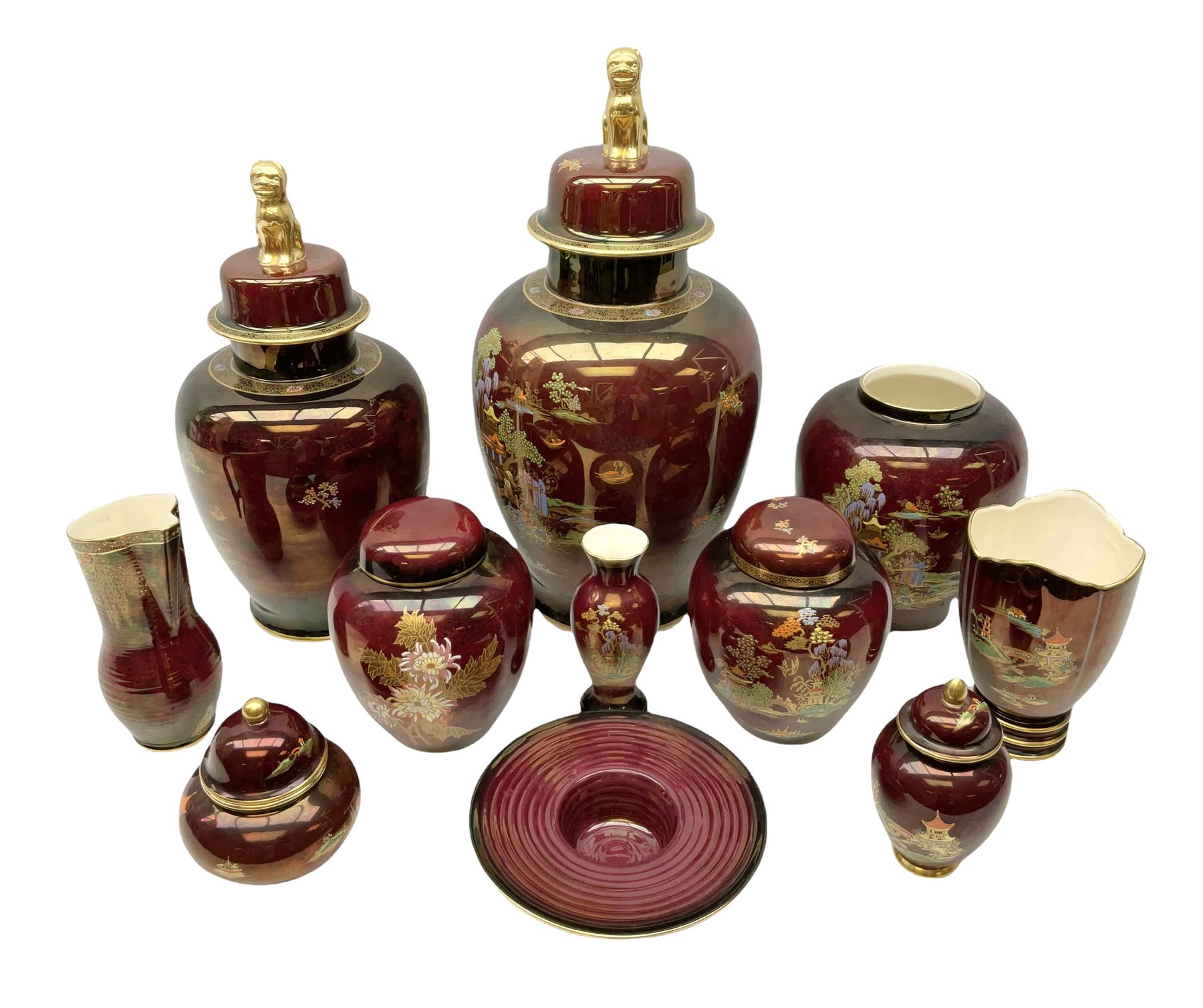 Two Crown Devon Rouge Royale pattern large temple jars with temple dog finial to lid, together with seven other Crown Devon ceramics and two lidded Carlton Ware temple jars in Red Royale, tallest example H47cm (11)