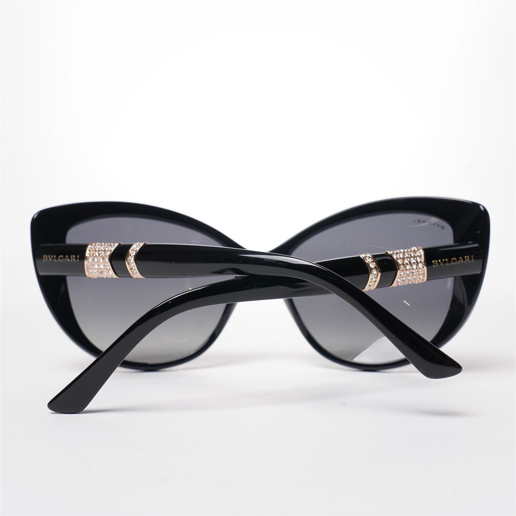 Bulgari - pair of oversized cat-eye sunglasses, with gradient tinted lenses in a black frame, the temples and arms with gold-tone hardware inset with pave-jewelled hinge detail, with original cloth pouch, hard leather case and box