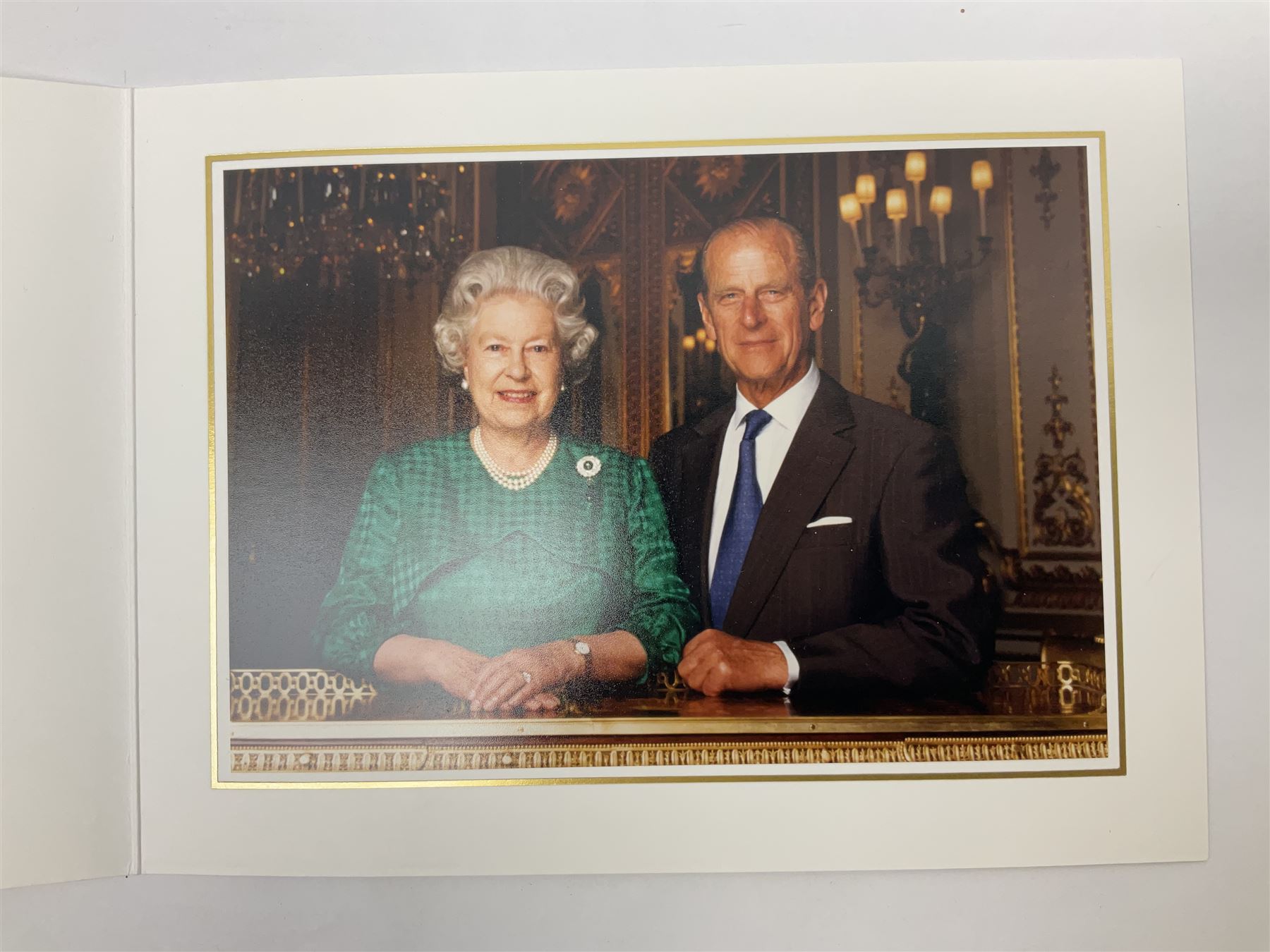 HM Queen Elizabeth II and HRH the Duke of Edinburgh - signed 1997 Christmas card with two gilt cyphers to front and colour photographic portrait inside,  signed Elizabeth R and Philip with manuscript date 1997 below