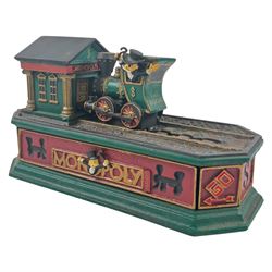  Uncle Sam mechanical money, together with The Monopoly collectors bank and Queen Elizabeth book  