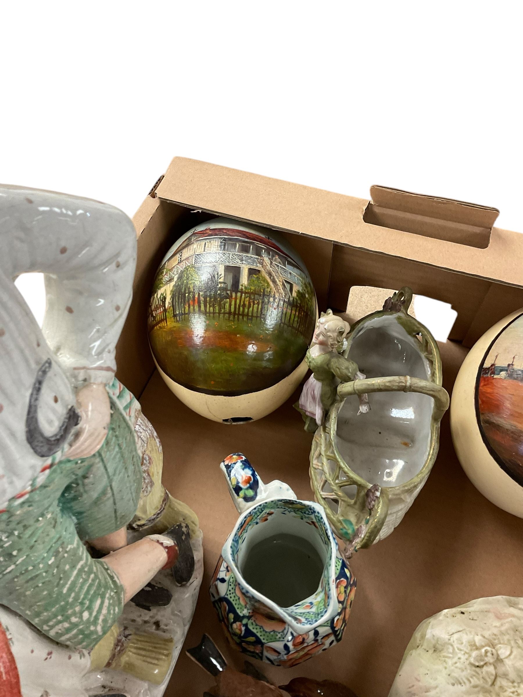 Two hand painted ostrich eggs, together with Staffordshire figure, lustre mug and other collectables 