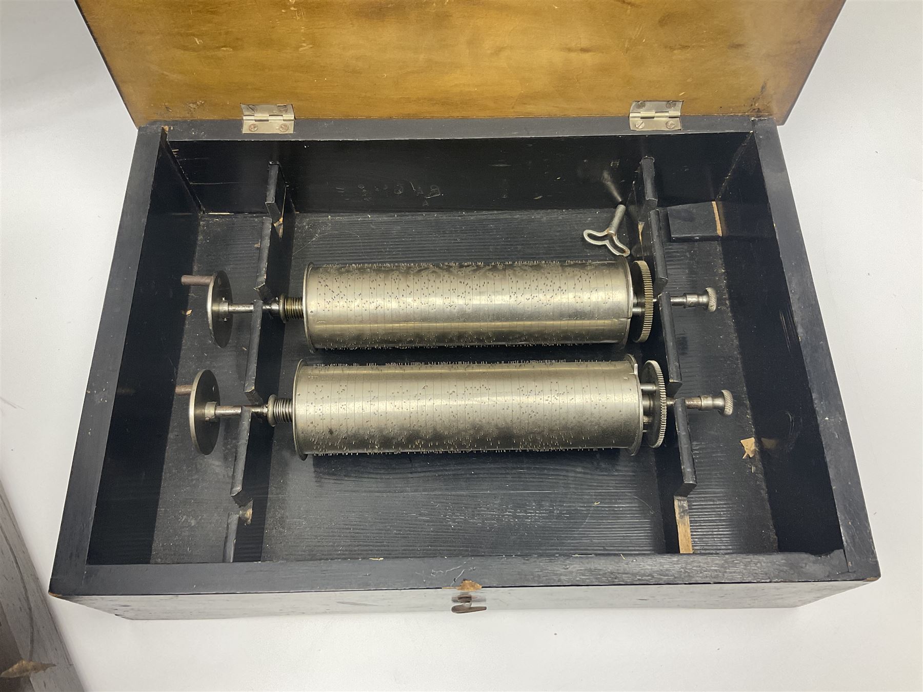 Swiss - 19th-century cylinder music box with three butterfly bells in sight, in a mahogany case with two separately boxed  6” cylinders, glazed viewing lid, 41 tooth comb (one tooth broken) crank key missing, movement untested.