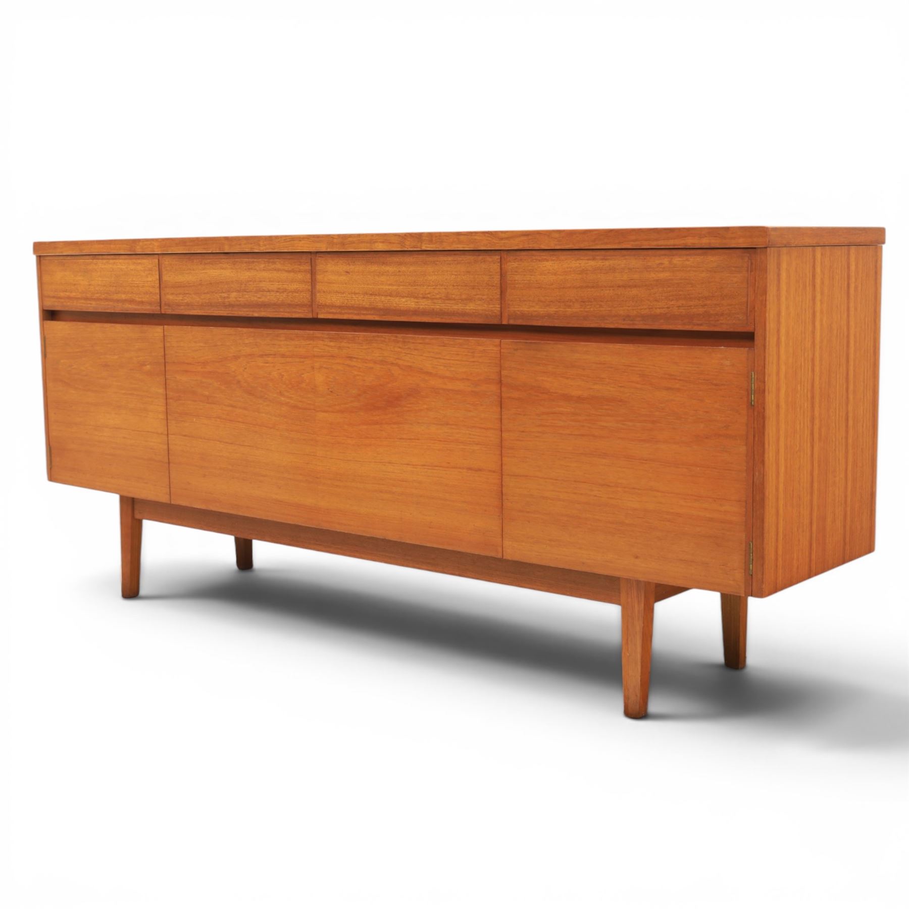 Mid-20th century teak sideboard, rectangular top above four frieze drawers with recessed handles, flanked by two cupboard doors with fall front central media cupboard