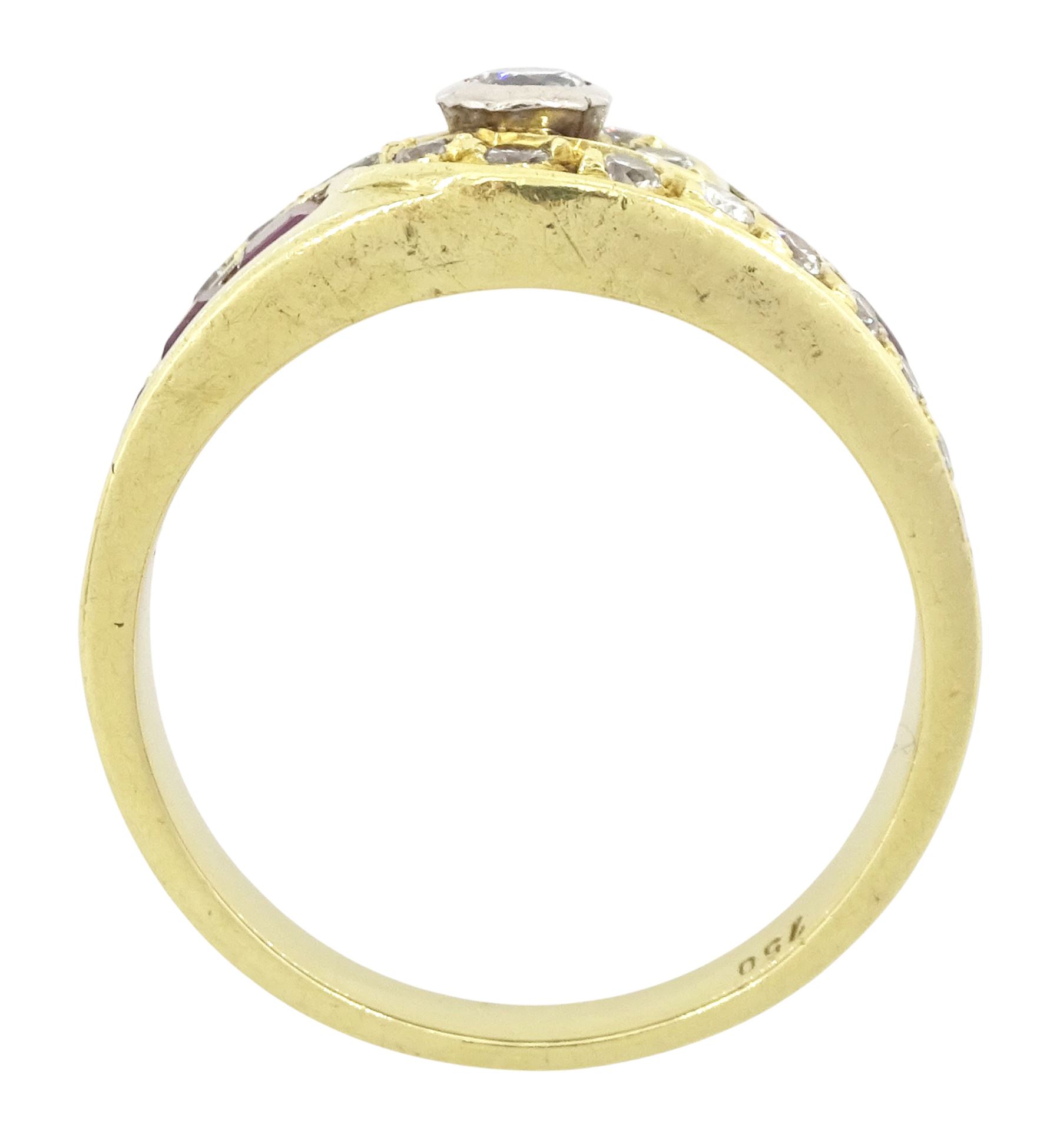18ct gold diamond and ruby crossover ring, the principal round brilliant cut diamond of approx 0.10 carat, with graduating round brilliant cut diamond and calibre cut ruby shoulders, stamped 750