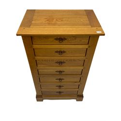 Light oak and cherry wood chest, fitted with seven drawers