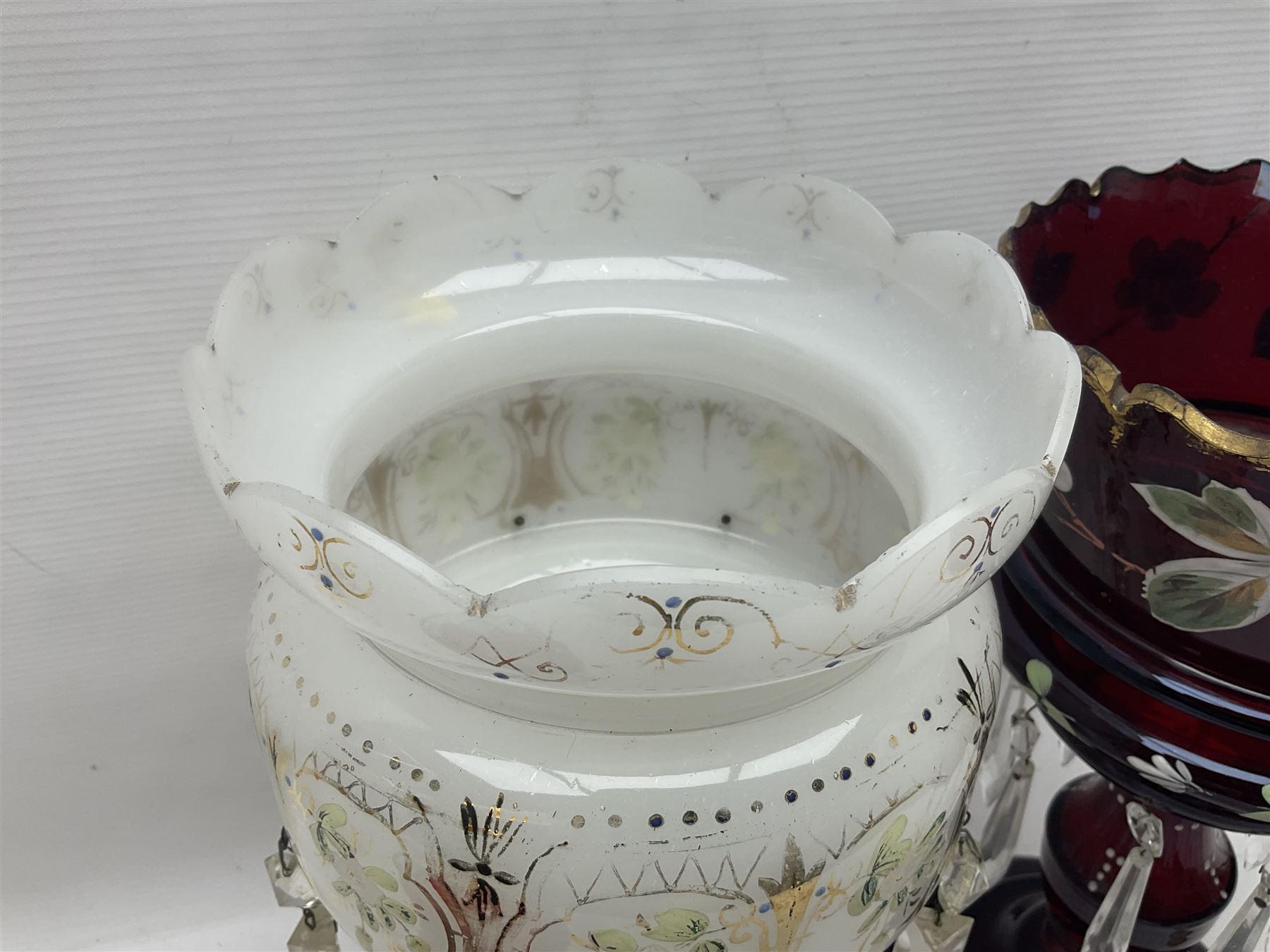 Bohemian red glass lustre, painted with stylised floral and foliate decoration, together with a milk glass example and two bohemian goblets converted to lustres 