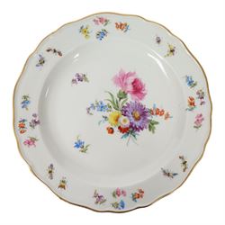 Four early 20th Century Meissen plates, hand painted with floral sprays, sprigs and inspects, with underglaze blue cross sword mark beneath, D21.5cm