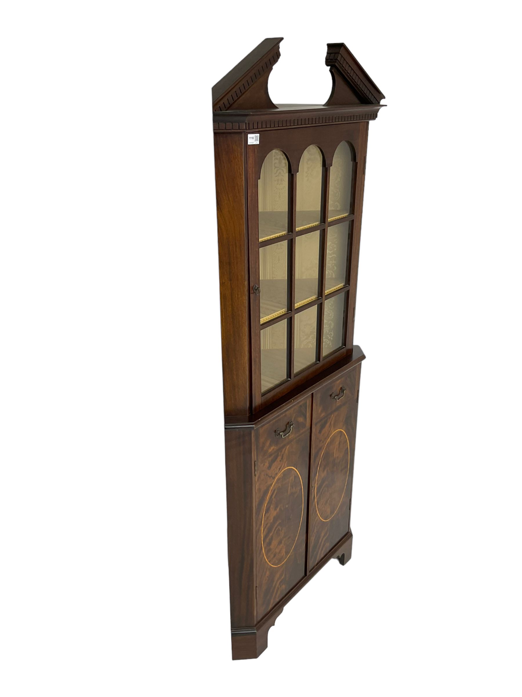 Georgian design inlaid mahogany corner cabinet, broken dentil pediment over single glazed door enclosing two shelves, base fitted with two doors with faux drawer facias