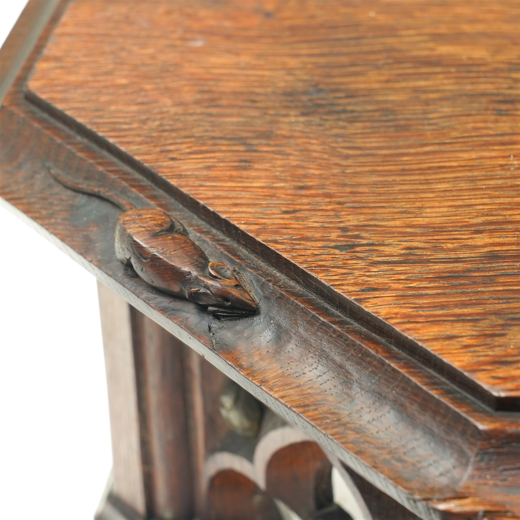 Mouseman - circa 1930s oak wedge shaped six sided plinth, of gothic design with carved berries and columnar supports, with carved mouse signature, by Robert Thompson of Kilburn