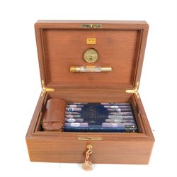 Elie Bleu of Paris, mahogany humidor with partitioned interior and inset hygrometer, together with two cigar cases and The Cigar Companion book