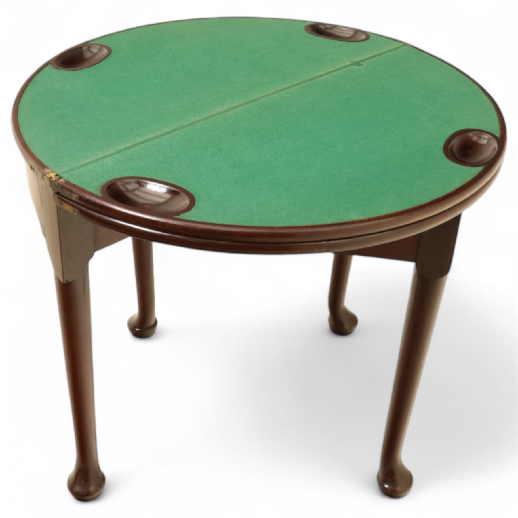 20th-century Georgian Revival style double fold-over card table, the first hinged circular top with polished mahogany surface above a second hinged circular top revealing a green baize playing surface with four counter-wells, underneath with a recessed compartment with and  chip and dice wells, the apron with fitted lock and key, raised on slender straight legs with pad feet 