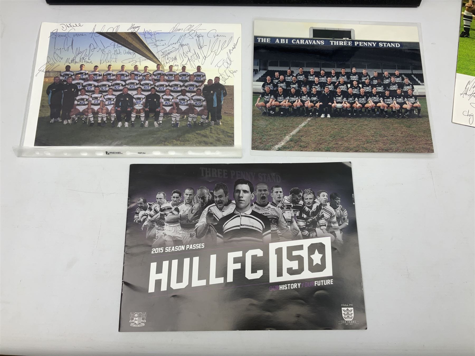 Hull F.C. memorabilia; Clive Sullivan 1986 memorial game programme, Open Evening 1994 programme with multiple player signatures, 'Old Faithful' 45rpm record, Wembley rosettes, 2000 team poster with facsimile signatures, framed print 'Farewell to the Boulevard 1895-2002', fully signed team photograph, various booklets, CD, DVD etc; and a folder containing the Merlin Rugby League card collection