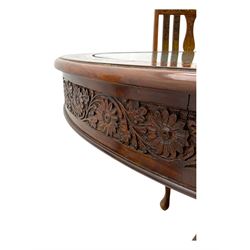 Pakistan carved hardwood brass inlaid circular dining table, and four rail back chairs with saddle seats