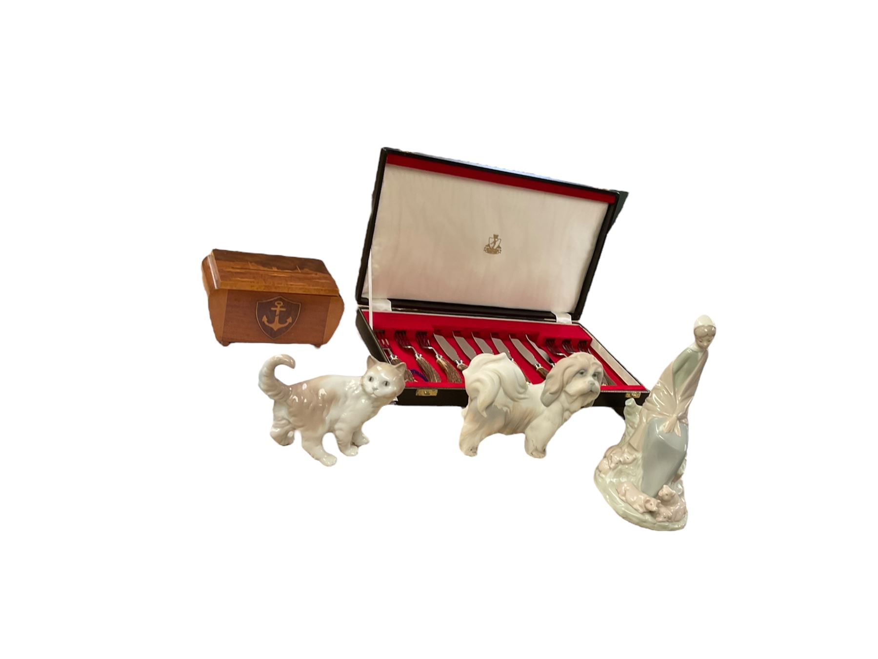 Horn handled canteen of cutlery set, together with with wooden cigarette box, two Nao figures and Lladro figure 