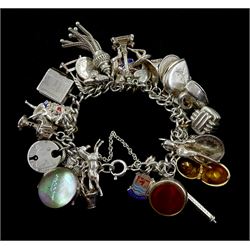 Silver charm bracelet, with Victorian and later charms including chick in an egg, pineapple , cherub, propelling pencil, stone set fob, horse etc