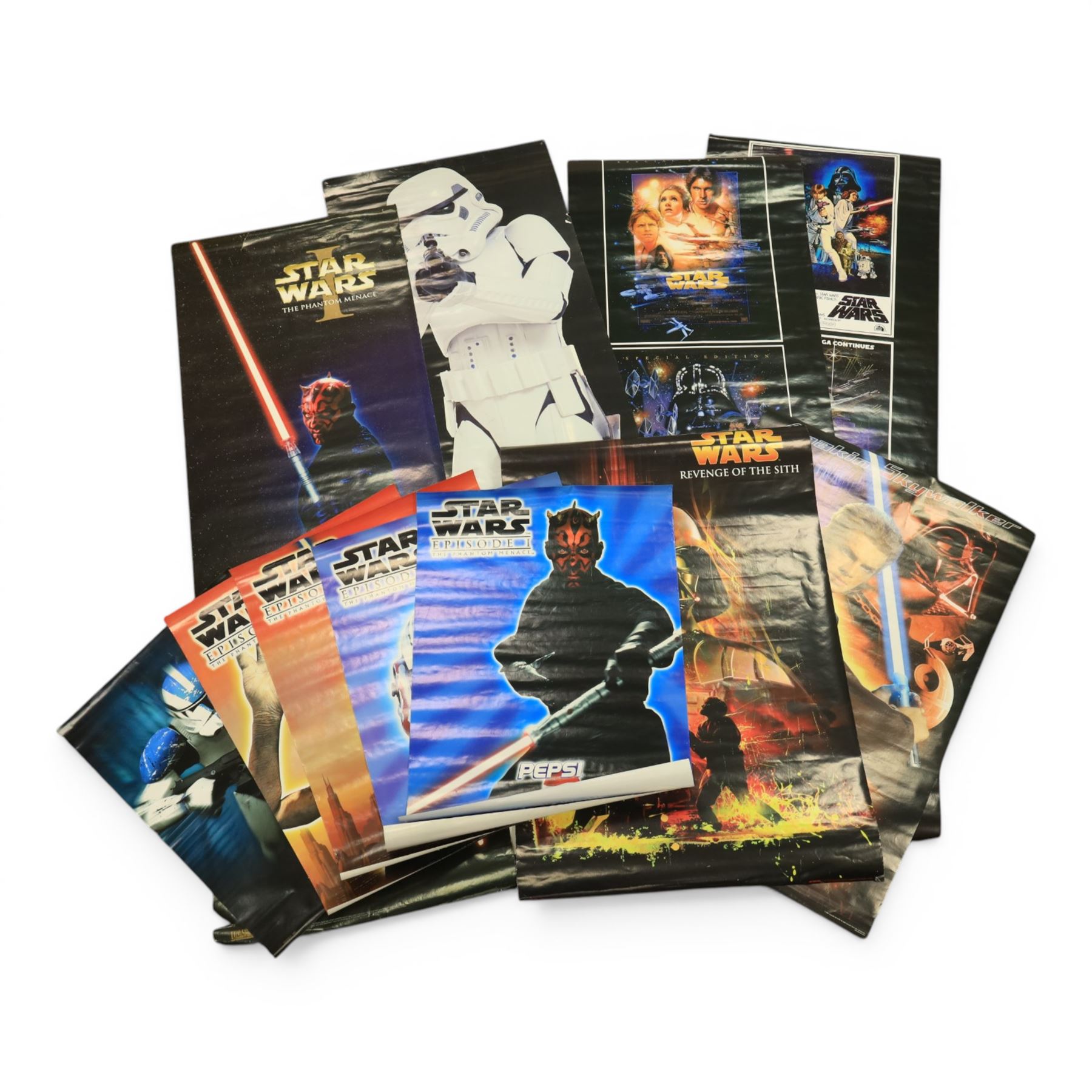 Collection of Star Wars posters, including two vintage 1970s/80s examples, PlayStation, Pepsi, door posters, special edition three film door scroll posters, DVD posters, Storm Trooper door poster, etc, vintage Alien poster and two framed Star Wars Heroes and Villains playing card posters