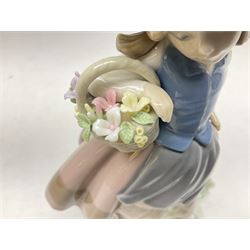 Three Lladro Flower Girls figures, comprising Sweet Scent no 5221, Pretty Pickings no 5222 and Spring is Here no 5223, largest example H18cm 