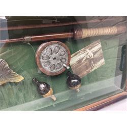 Four framed sporting memorabilia displays, the largest example containing 1930s cricket memorabilia, together with two fishing displays and a football display, each within wooden glazed frames, largest H105cm