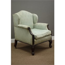  19th century mahogany wing back armchair, wide seat, upholstered sprung seat with loose cushion, scrolled arm terminals and cabriole feet, W72cm  